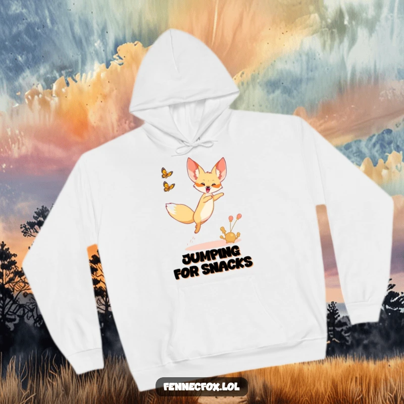Funny hoodie showing a fennec fox joyfully leaping into the air, chasing a desert butterfly.