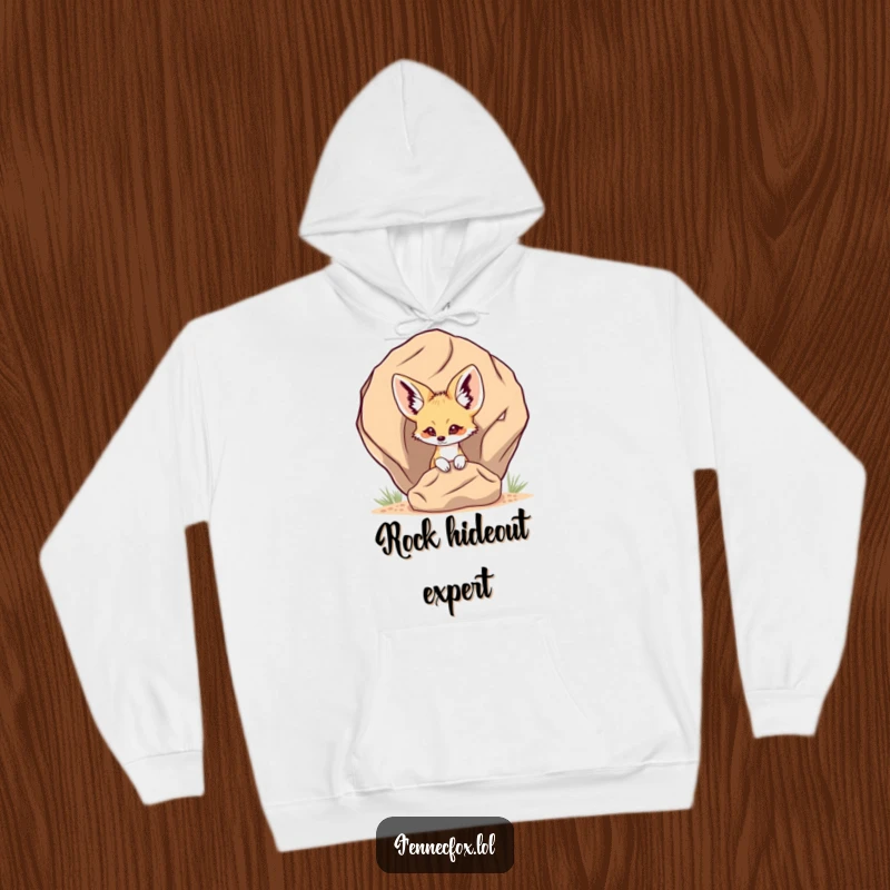 Funny Fennec Fox Hoodie with a fennec fox playfully peeking from behind a desert rock, offering warmth and a touch of secretive charm.