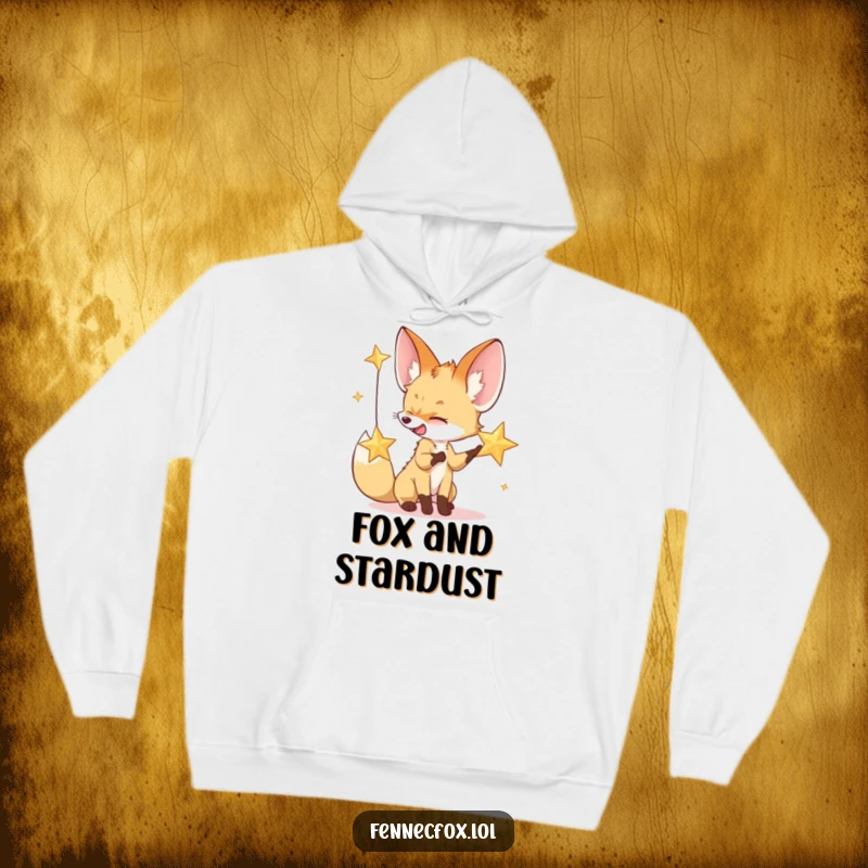 Funny hoodie featuring a fennec fox playfully reaching for a sparkling desert star, embodying nighttime magic and warmth.