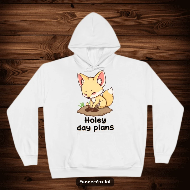 Funny fennec fox hoodie with a character digging a hole, offering warmth and a touch of playful adventure.