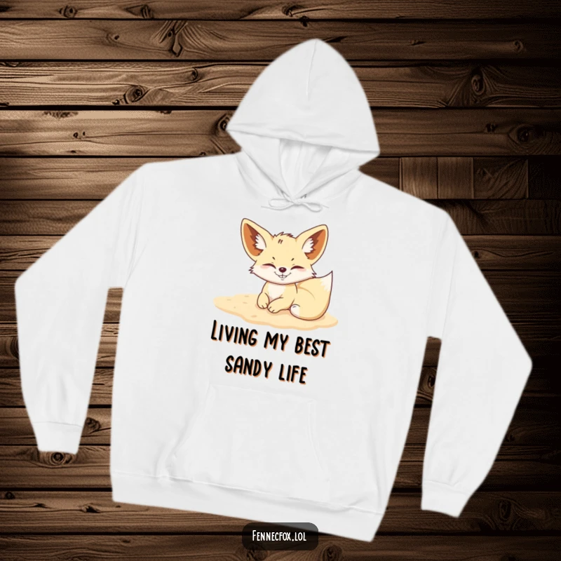 Funny Fennec Fox hoodie showing a mischievous fox rolling in soft sand, perfect for cozy, playful wear.