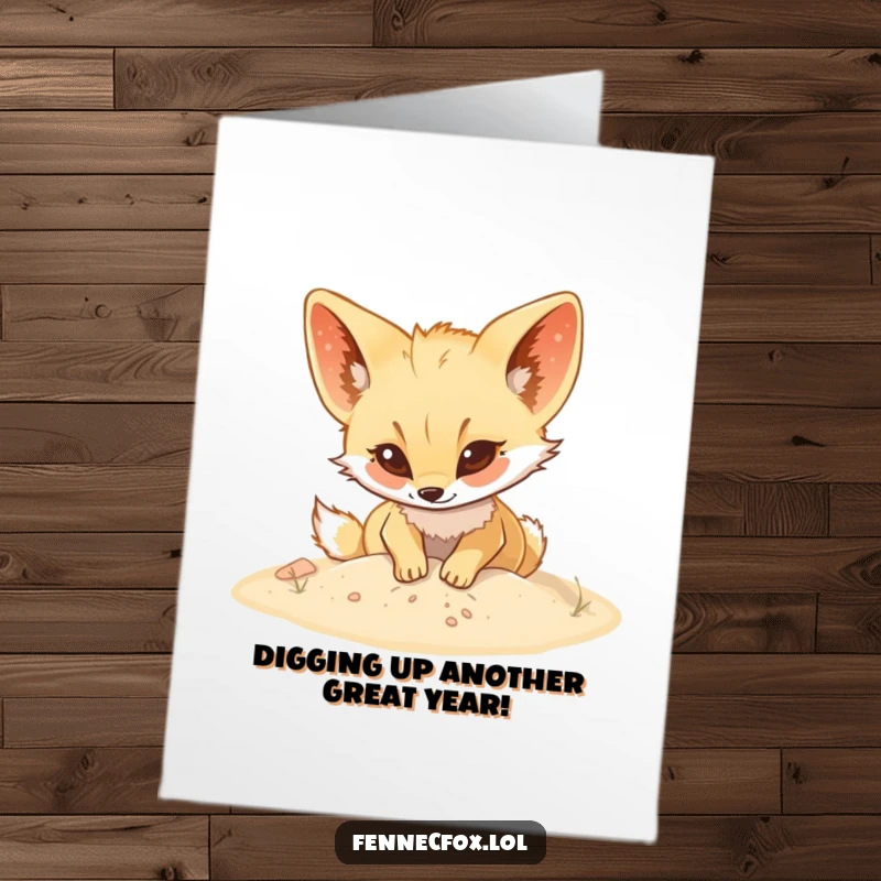 Funny Free Printable birthday card of a fennec fox enthusiastically digging in soft sand, ready to bury gifts.