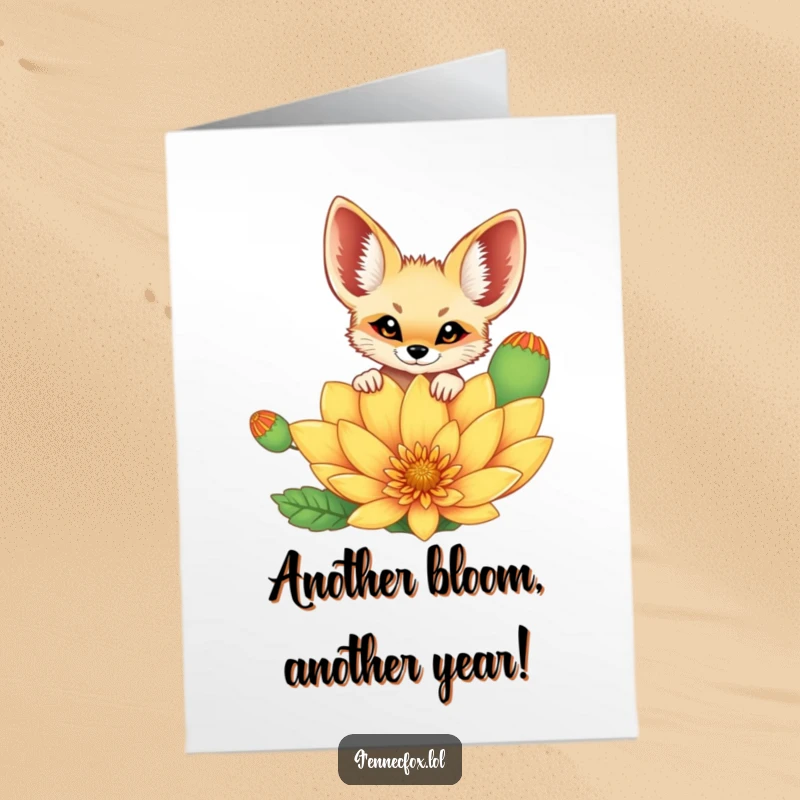 Funny Free Printable Birthday Card showing a cheerful fennec fox curiously peeking over a large, colorful desert flower.
