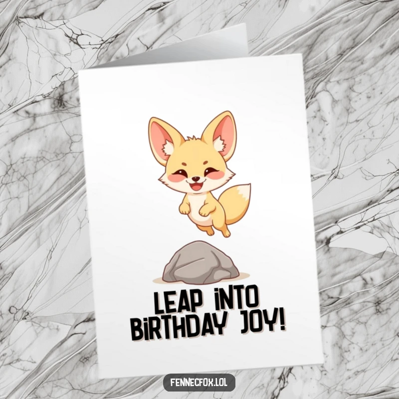 Funny Free Printable Birthday Card: A fennec fox with a huge smile and large ears joyfully leaping over a small rock.