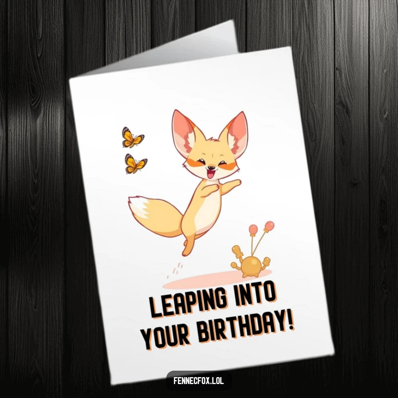 Funny Free Printable Birthday Card: A fennec fox joyfully leaping in the air, chasing a butterfly, capturing birthday excitement.