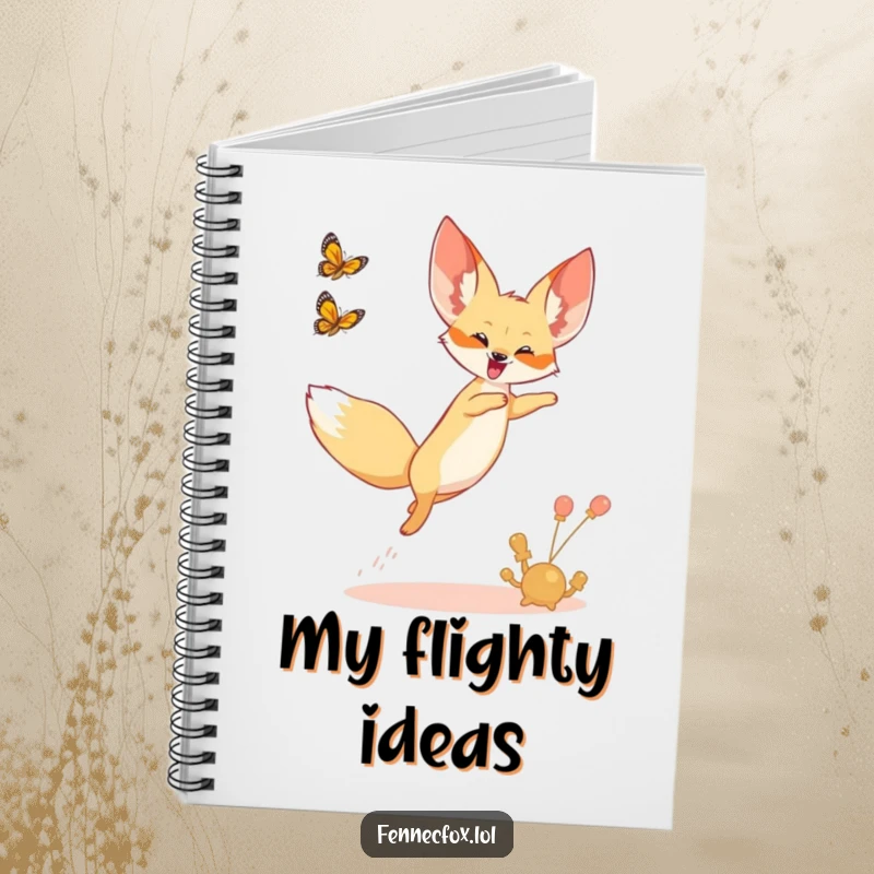 Funny notebook with a fennec fox leaping joyfully into the air, chasing a butterfly.