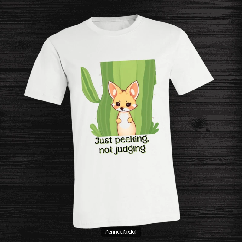 Funny Fennec Fox T-Shirt featuring a cute fox with big ears curiously peeking from behind a large desert cactus. Humorous and engaging.